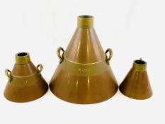 Three copper and brass conical shaped measures: 10 litres, 2 litres, and 1 litre