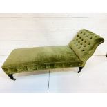 Green velvet button back upholstered chaise lounge.