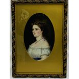 Gilt framed and glazed oil on board portrait of a lady in an oval mount