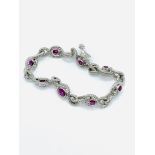 White gold, ruby and diamond twist bracelet