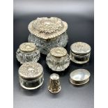 Six silver lidded glass pots
