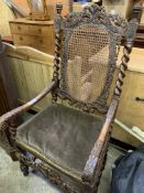 Victorian heavily carved oak open arm chair