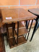 Inlaid walnut veneer four sided bookcase on casters