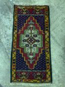 Hand knotted wool rug with geometric pattern