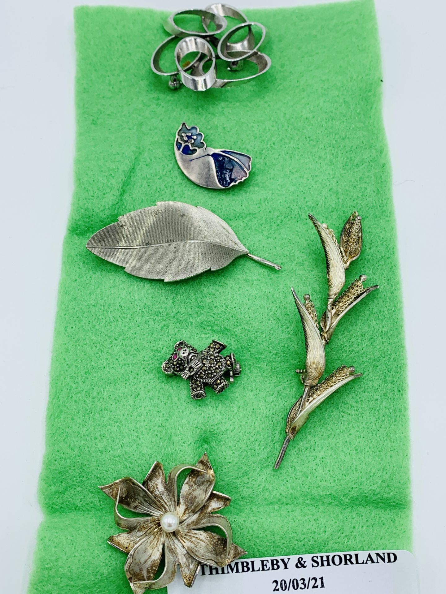 Six sterling silver brooches