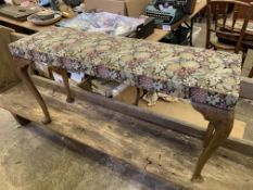 A weathered church pew with open back, together with a long stool