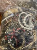 Three bags of costume jewellery and watches