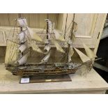 Two wooden model sailing ships