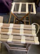 Four wooden and webbing suitcase stands, together with another.