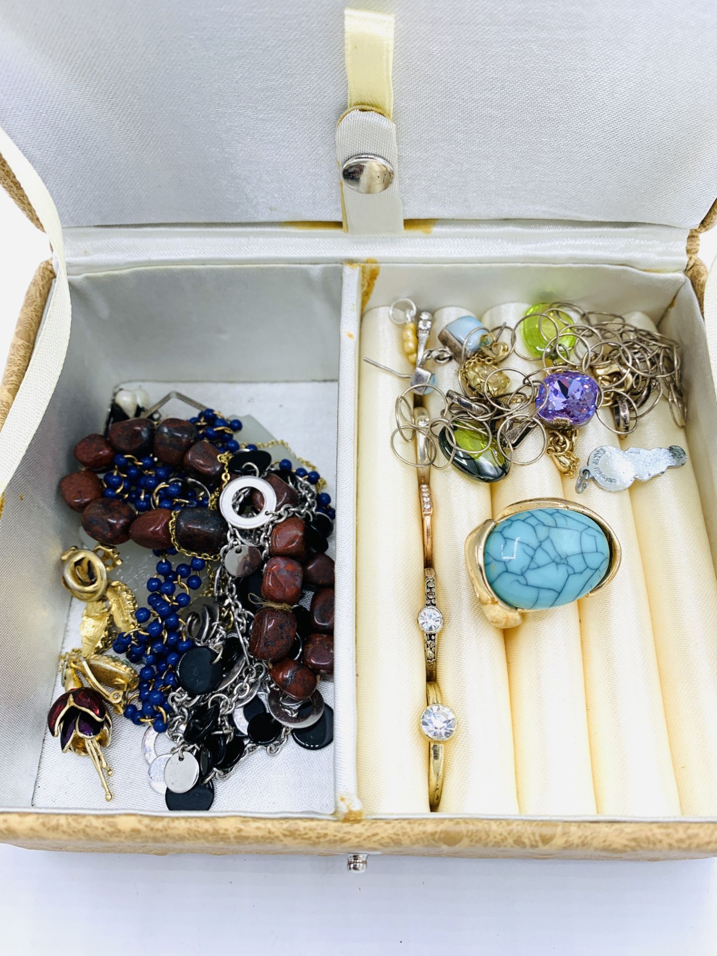 Two cases of costume jewellery.