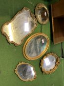 Five various gilt frame wall mirrors.