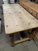 Pine kitchen table on turned supports with stretcher to base