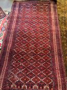 Dark red ground hand knotted rug