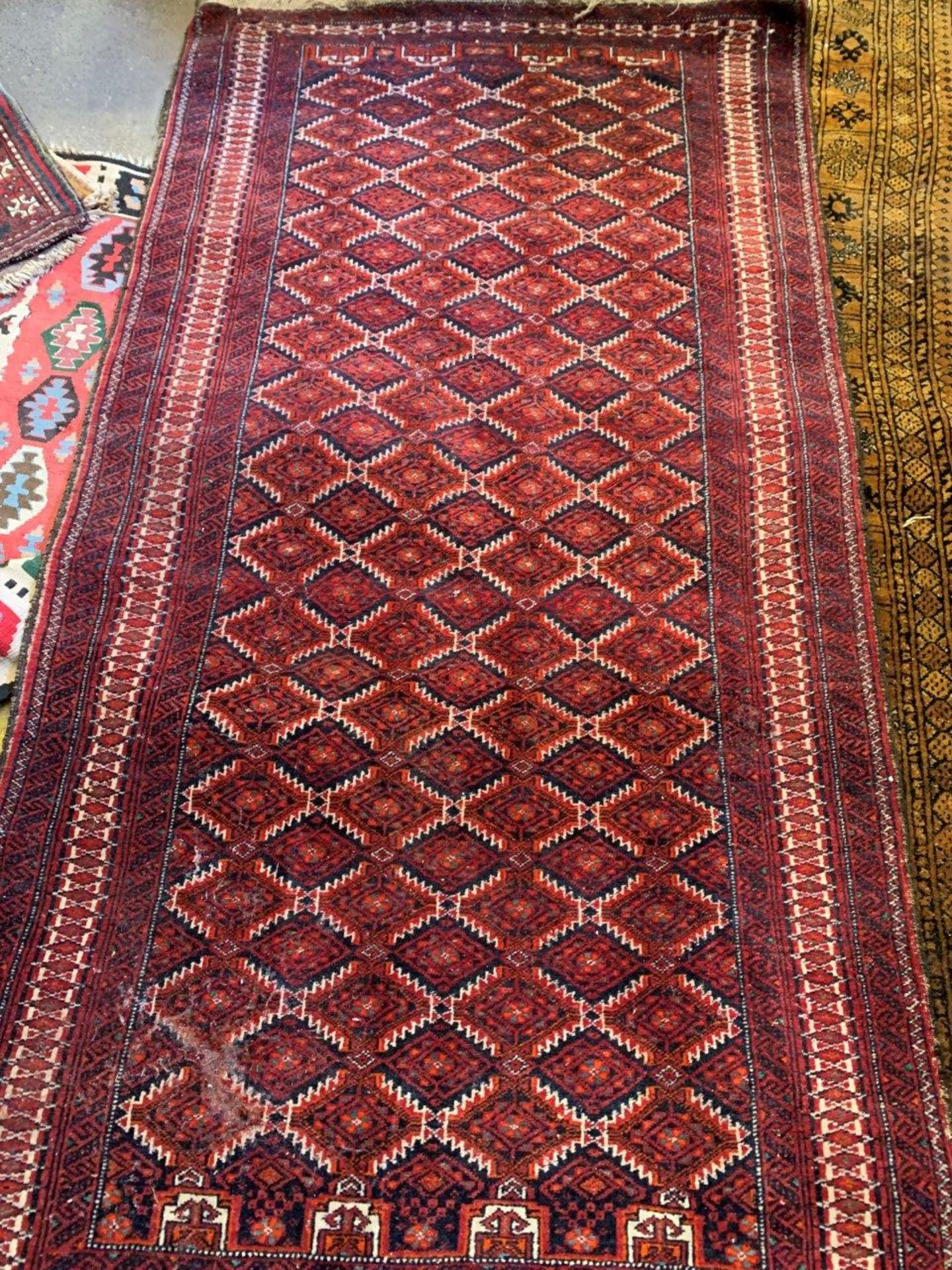 Dark red ground hand knotted rug