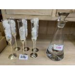Six Vera Wang Love Knots champagne flutes and a silver topped glass decanter