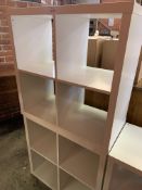 Three white painted four compartment storage units and a white painted six shelf storage unit