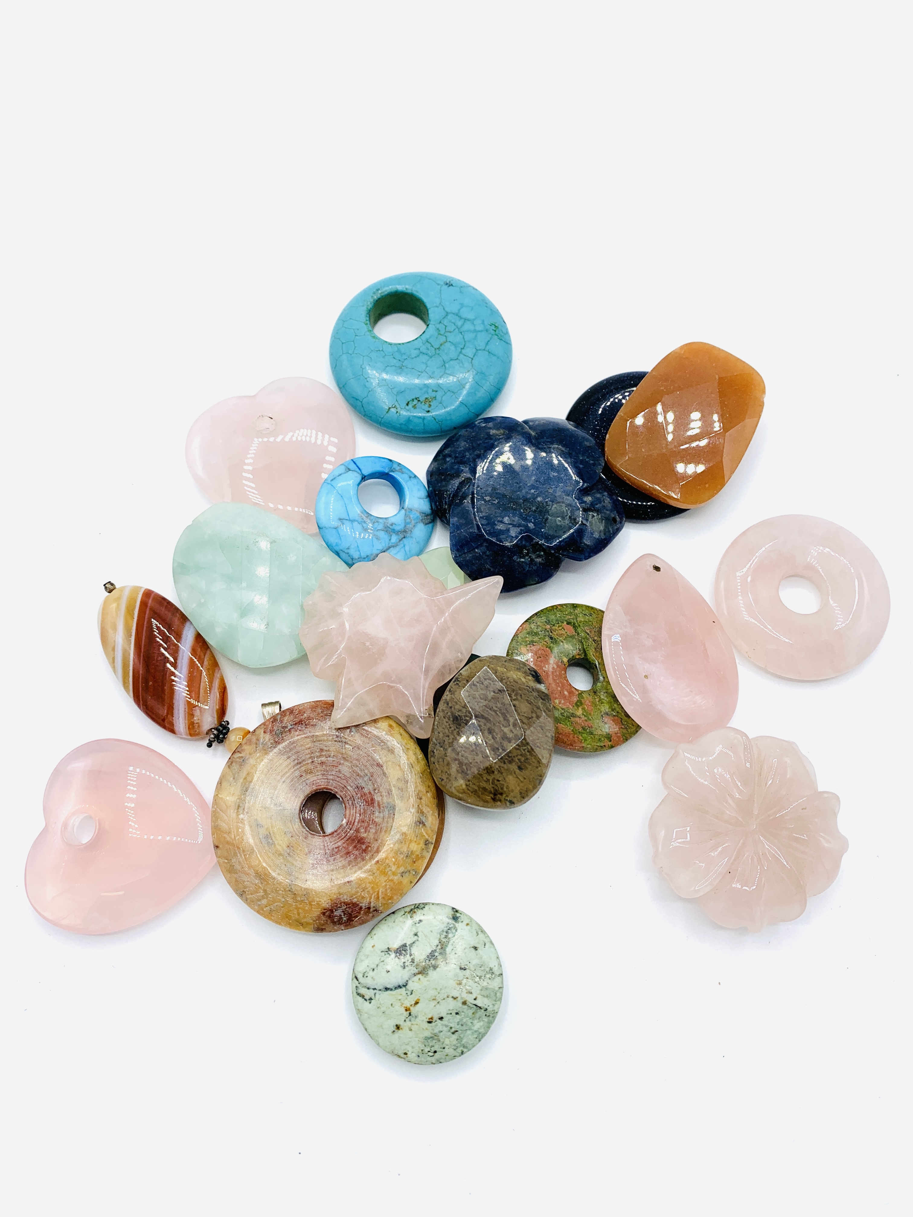 Twenty assorted gemstone pendants