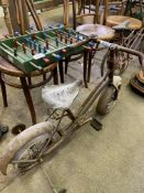 Two early 20th Century children's bicycles together with an early child table football.