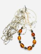 Four various pearl and amber necklaces