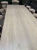 Large laminated painted farmhouse kitchen table with two carvers and nine chairs