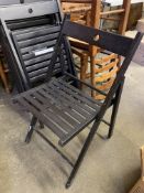 Six black Ikea folding chairs