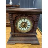 Oak cased mantel clock by Ansonia Clock Company of New York.
