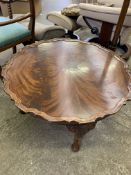 Mahogany circular occasional table, a mahogany torchere, and a set of wall mounted shelves