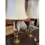 Pair of brass three column twin light adjustable height table lamps.