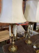 Pair of brass three column twin light adjustable height table lamps.