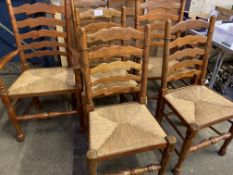 Six mahogany ladder back dining chairs with string seats