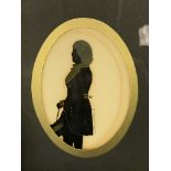 Three framed and glazed silhouettes in oil, and three framed miniature portraits of young ladies