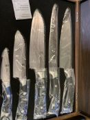 Five piece knife set in wooden box.