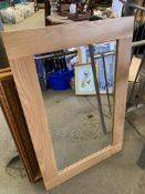 Two bevelled edge wood frame mirrors