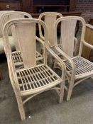 Four cane armchairs