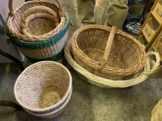 Five various wicker baskets together with two raffia wastepaper baskets.