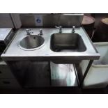 Double hand wash sink with taps and under shelf with splash back