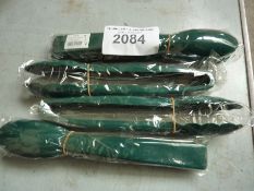 Four plastic tongs