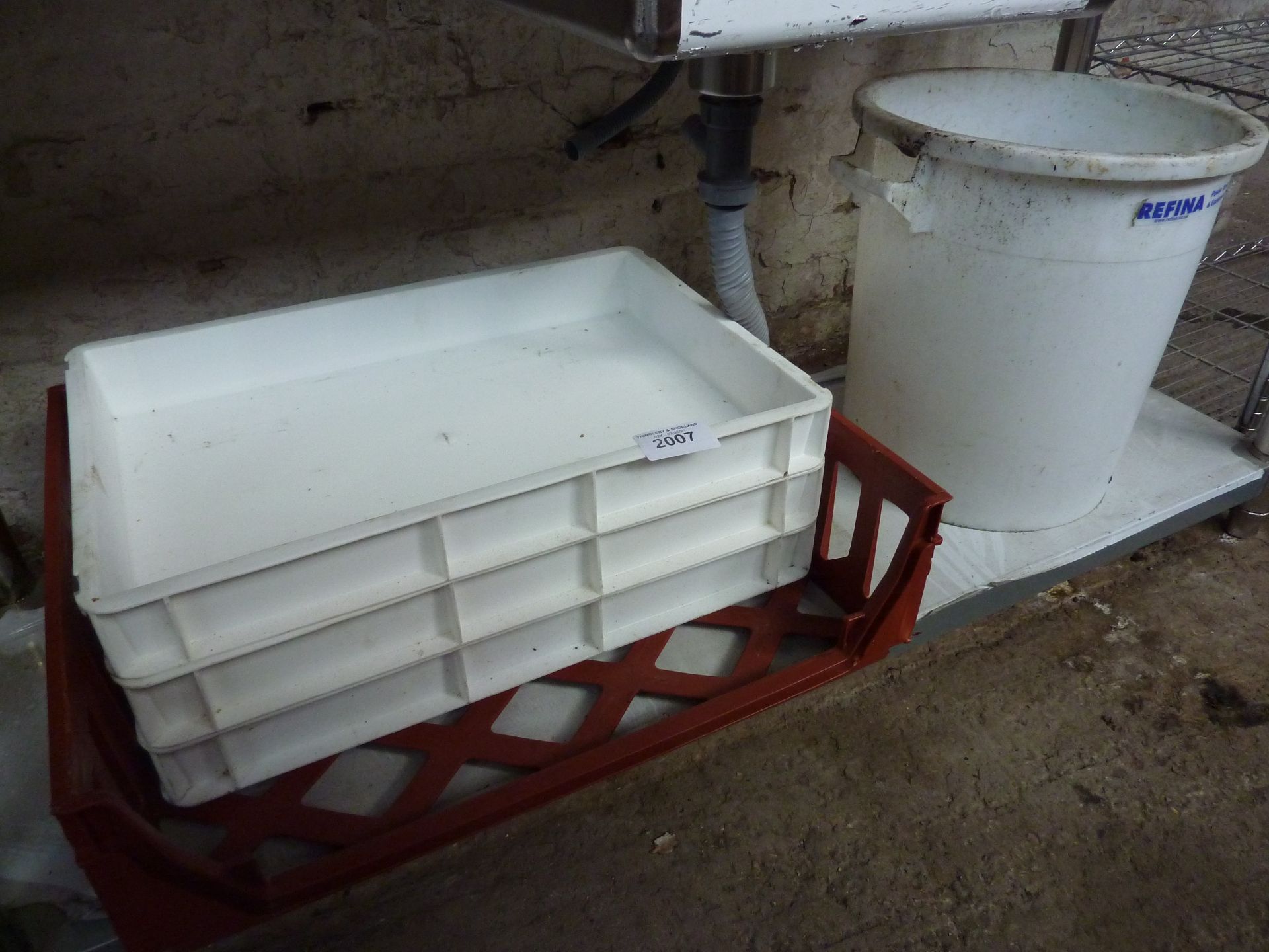 Four plastic trays and a bucket