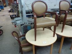 Wooden table with two upholstered chairs