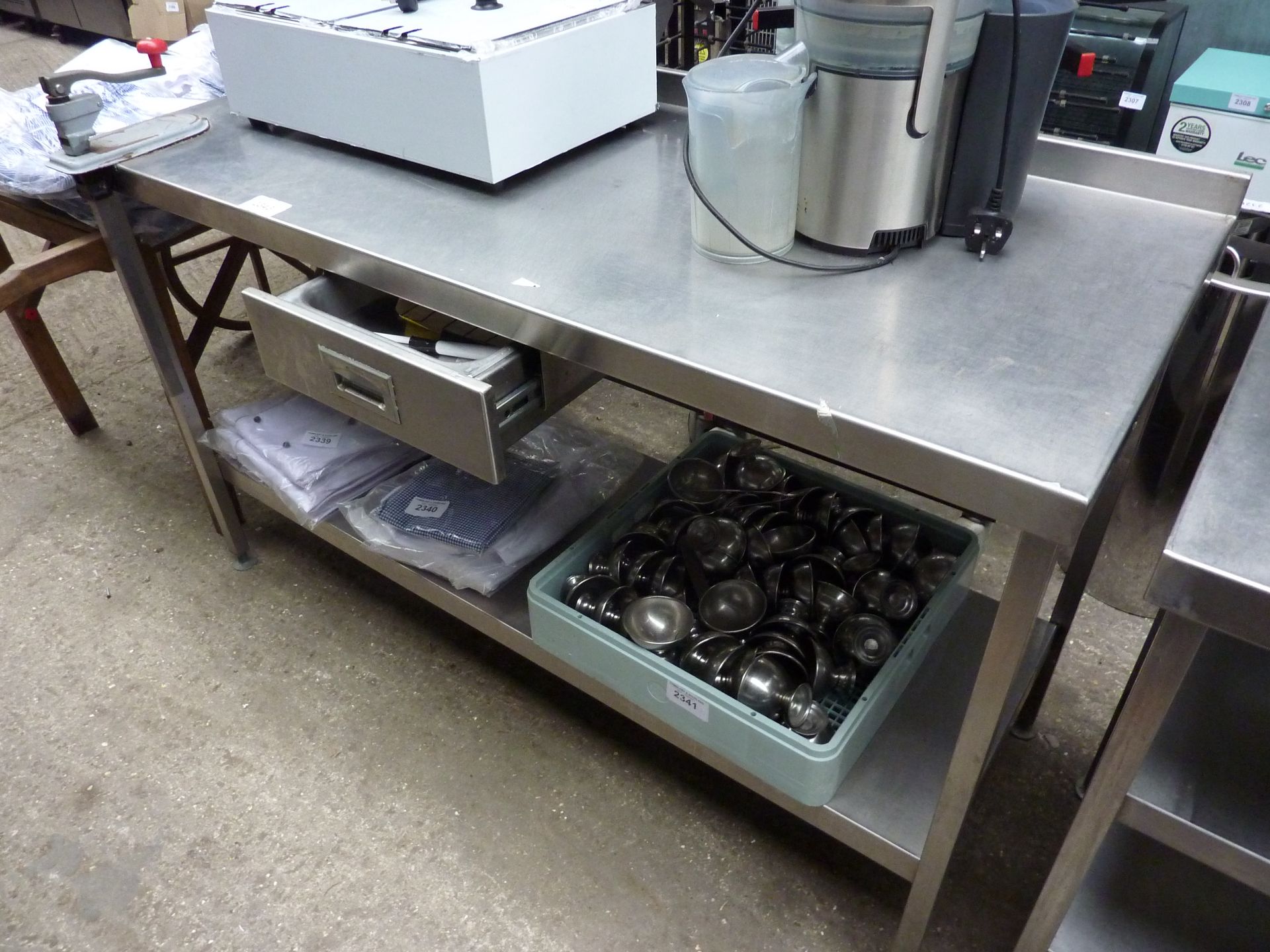 Stainless steel prep table with drawer, shelf and tin opener