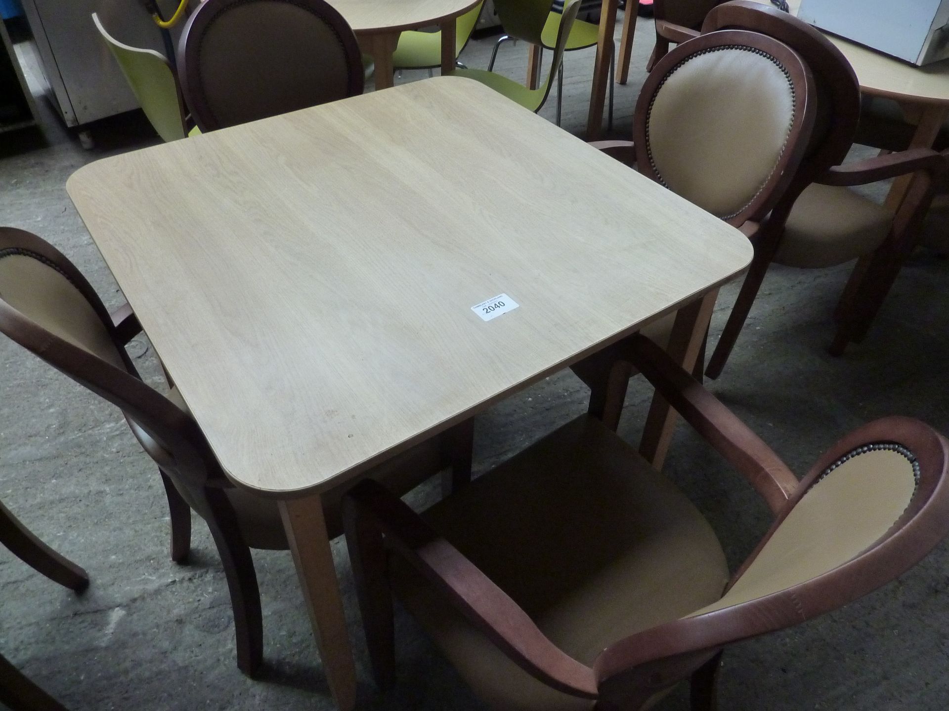 Wooden table with four upholstered chairs