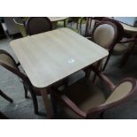 Wooden table with four upholstered chairs