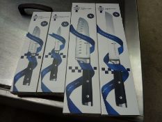 Four Le Cordon Bleu knives, small and large santoku, bread and utility.