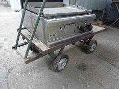 Four wheel trolley.