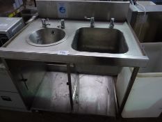 Double hand wash sink with taps and under shelf with splash back