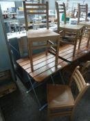 Folding table and two chairs.