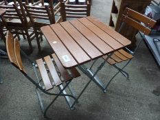 Folding table and two chairs.