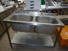 Double bowl sink with taps.