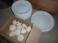 Quantity of plates and teapot lids.