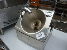 Hand wash sink with mixer taps.